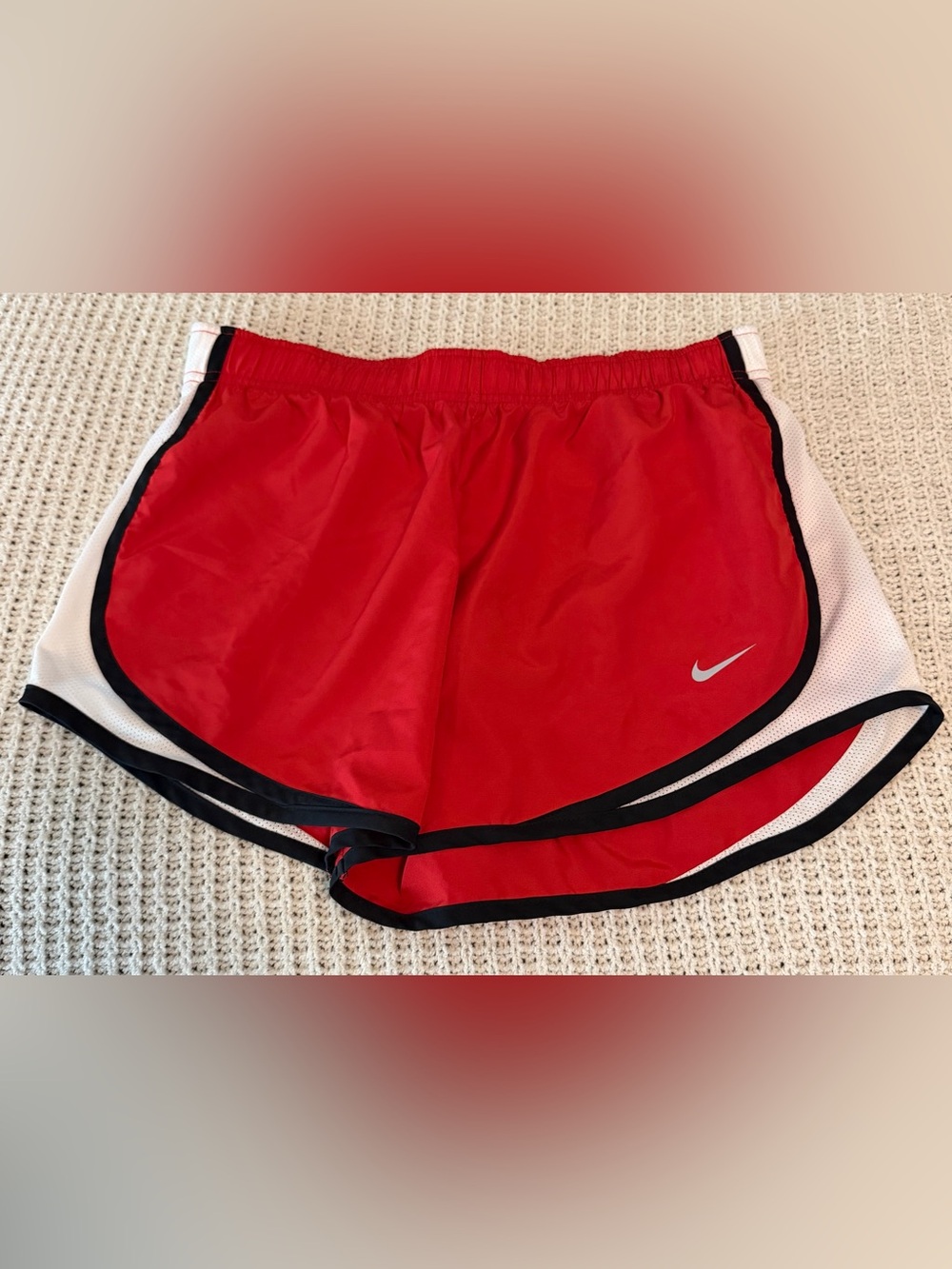 Nike Red Athletic Shorts with White Side Panels and Black Trim